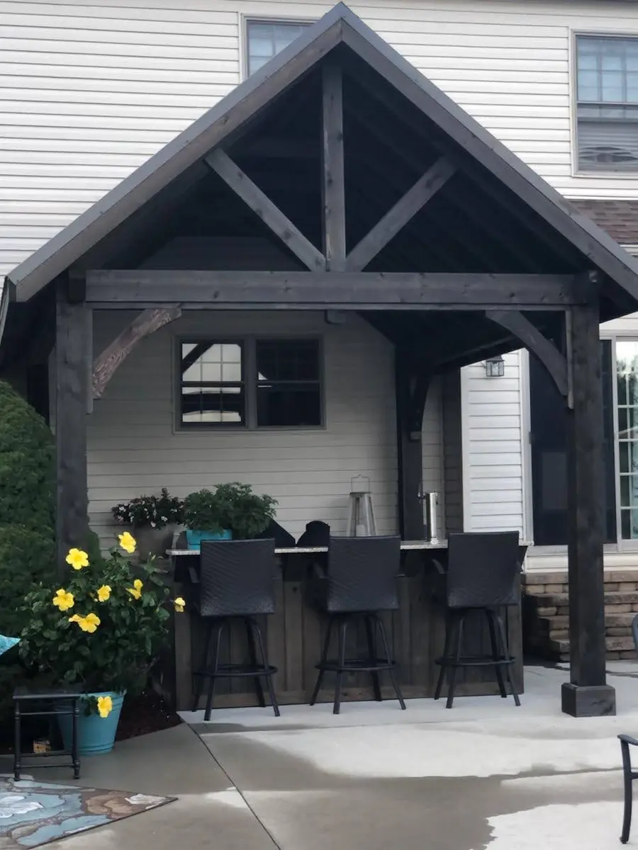 Finished timber gazebo with seating and serving space by Dave's Landscaping