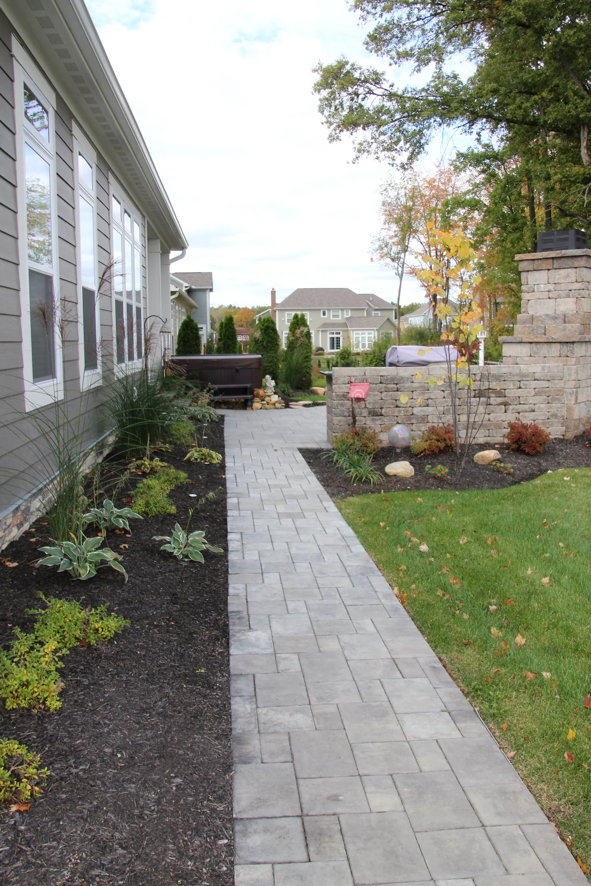 Paver walkway and new landscape planting by Dave's Landscaping