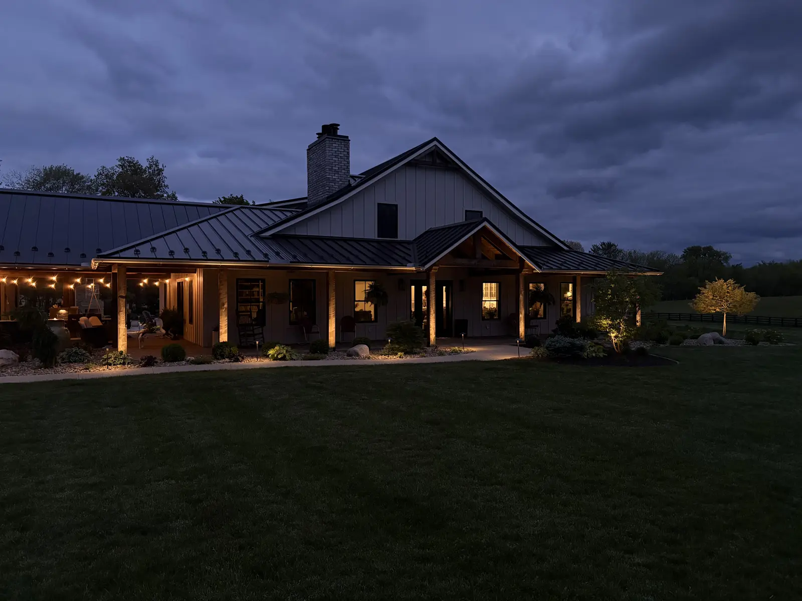 Covered patio lighting by Dave's Landscaping