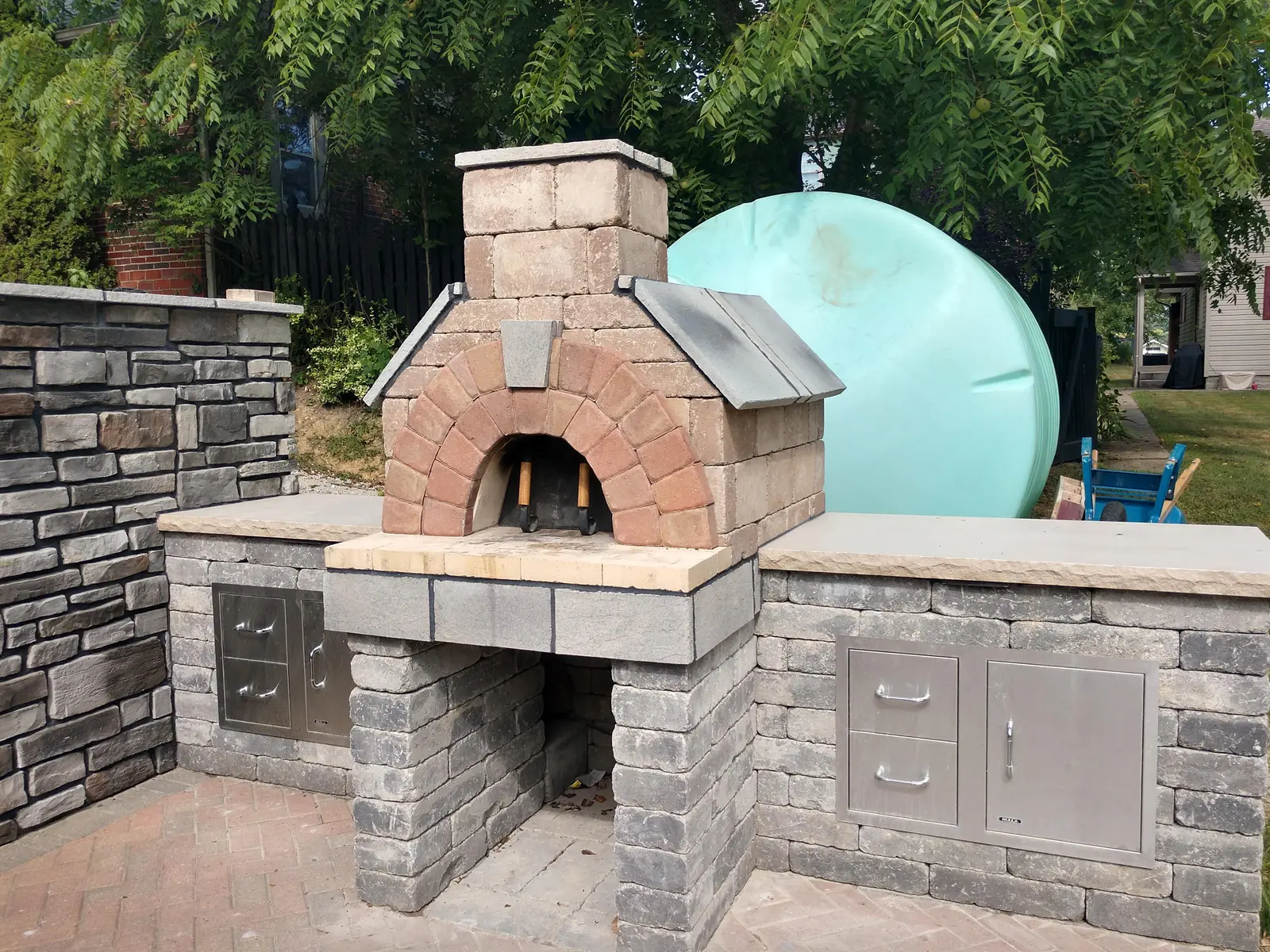 Masonry pizza oven and stainless outdoor kitchen detail by Dave's Landscaping