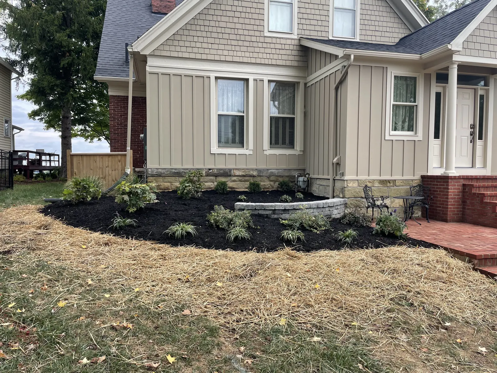 New foundation planting installed along a residential facade by Dave's Landscaping